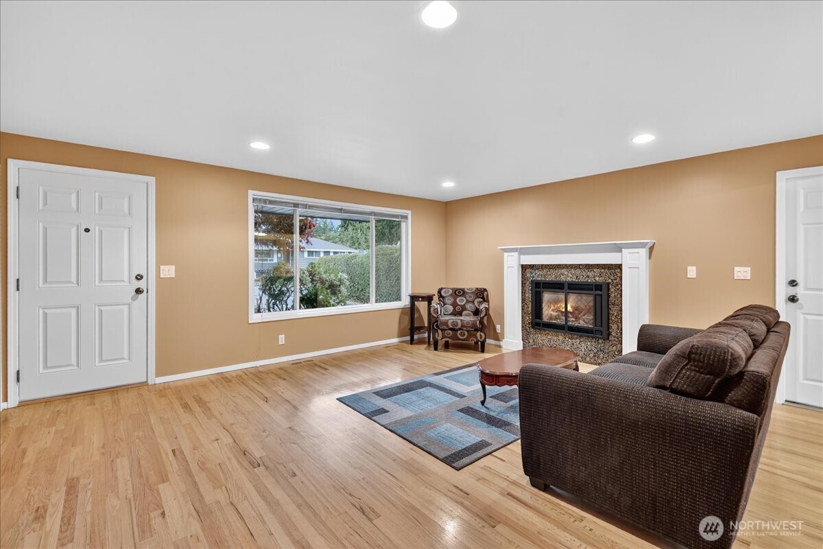 20721 81st Avenue West Edmonds, WA 98026 - Photo 3 of 25 a living room with furniture and a fireplace