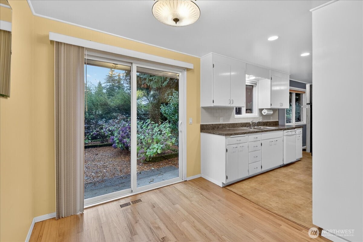20721 81st Avenue West Edmonds, WA 98026 - Photo 6 of 25 a kitchen with stainless steel appliances granite countertop a stove a sink and a granite counter top