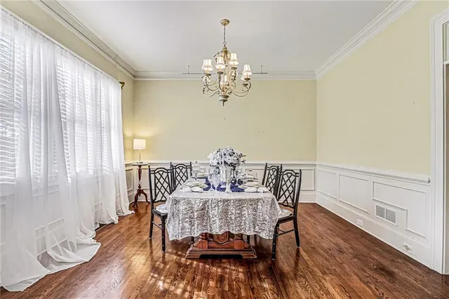 a view of a house with a yard and sitting area