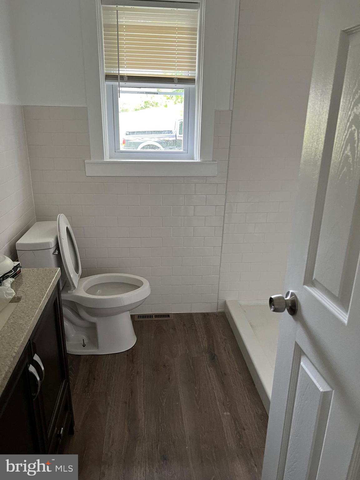 1024 Crestview Avenue Reading, PA 19607 - Photo 6 of 11 a white toilet sitting in a bathroom next to a window