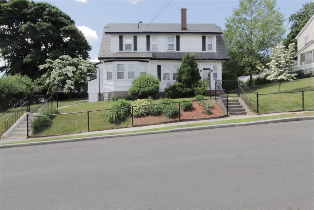 front view of a house with a small yard