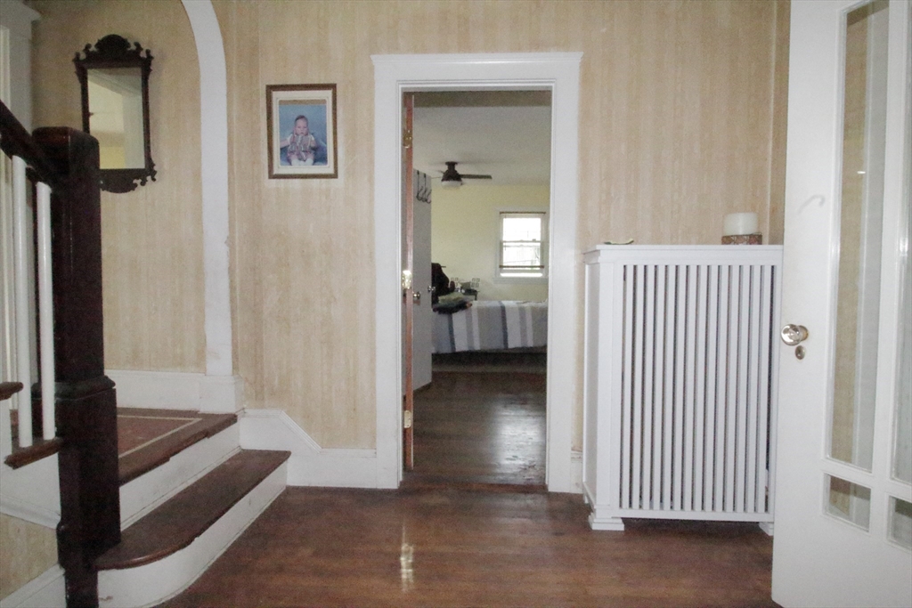 36 Kimball Road Chelsea, MA 02150 - Photo 14 of 24 a view of a hallway with a livingroom and windows