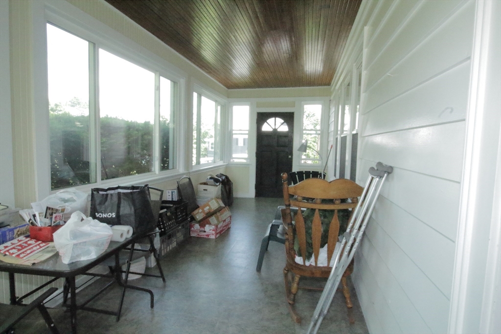 36 Kimball Road Chelsea, MA 02150 - Photo 15 of 24 a living room with furniture and a floor to ceiling window