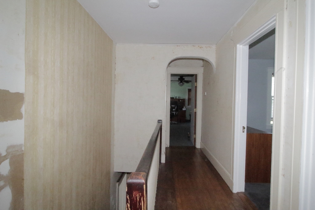 36 Kimball Road Chelsea, MA 02150 - Photo 20 of 24 a view of a hallway with wooden floor and staircase