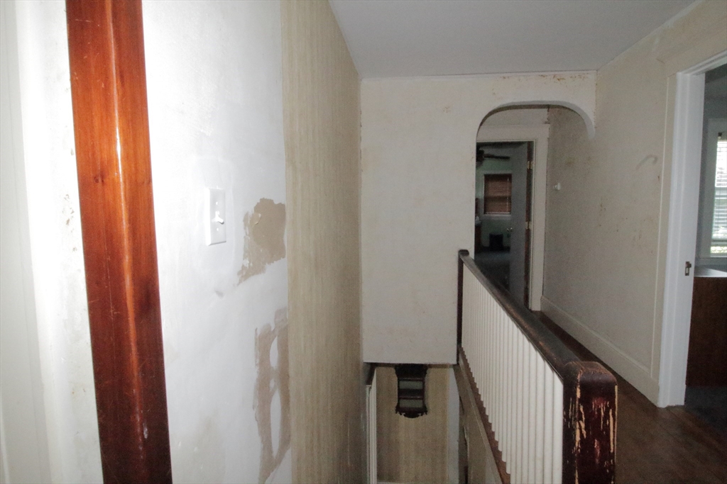36 Kimball Road Chelsea, MA 02150 - Photo 24 of 24 a view of a hallway with wooden floor and staircase
