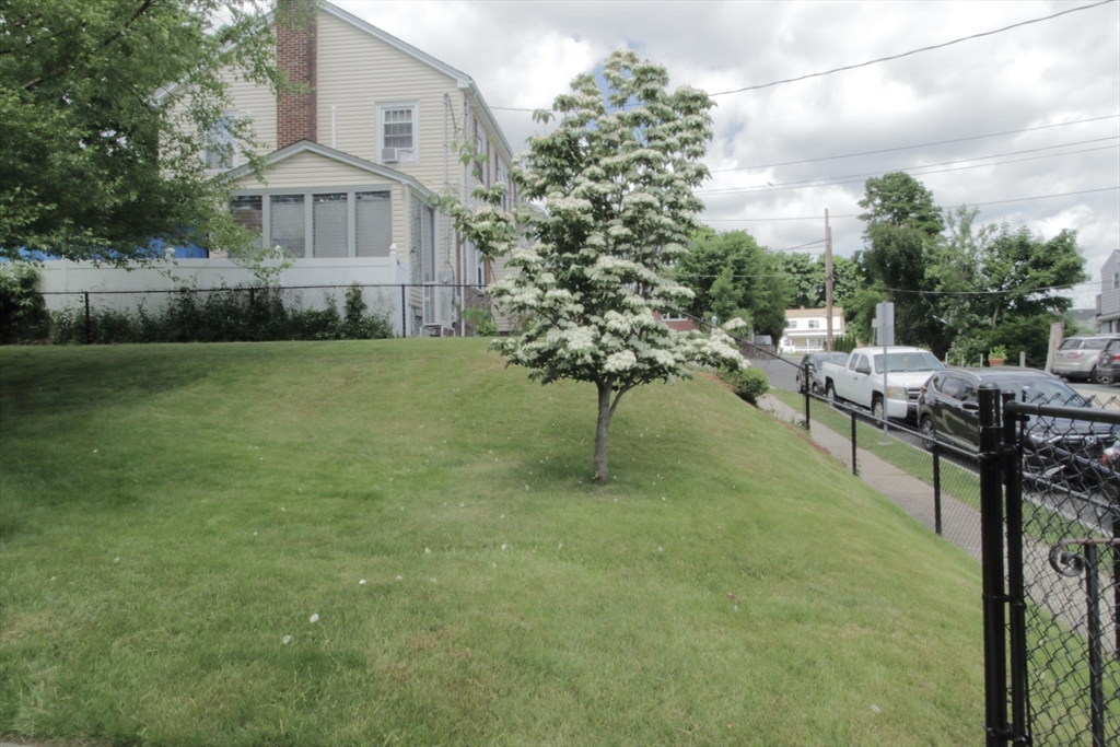 36 Kimball Road Chelsea, MA 02150 - Photo 4 of 24 a view of a yard in front of a house