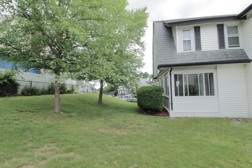 36 Kimball Road Chelsea, MA 02150 - Photo 6 of 24 a view of a house with a yard