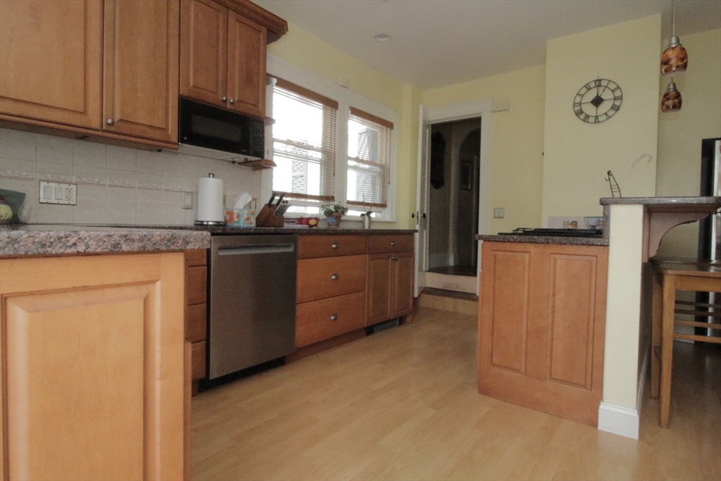 36 Kimball Road Chelsea, MA 02150 - Photo 8 of 24 a kitchen with stainless steel appliances granite countertop a stove a refrigerator and a refrigerator