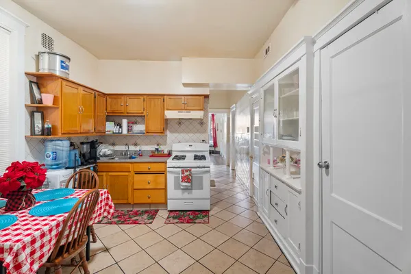 a large kitchen with stainless steel appliances lots of counter top space