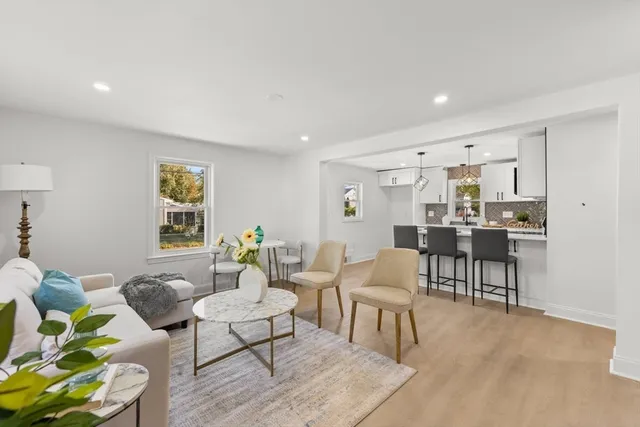 a living room with furniture and a table