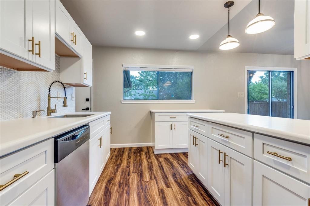 7904 Simpkins Place Plano, TX 75025 - Photo 15 of 24 a kitchen with white cabinets appliances and a window