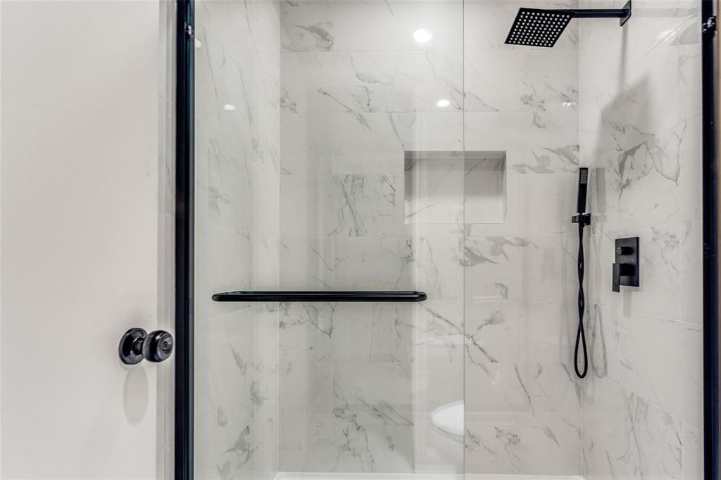 7904 Simpkins Place Plano, TX 75025 - Photo 19 of 24 a bathroom with a shower