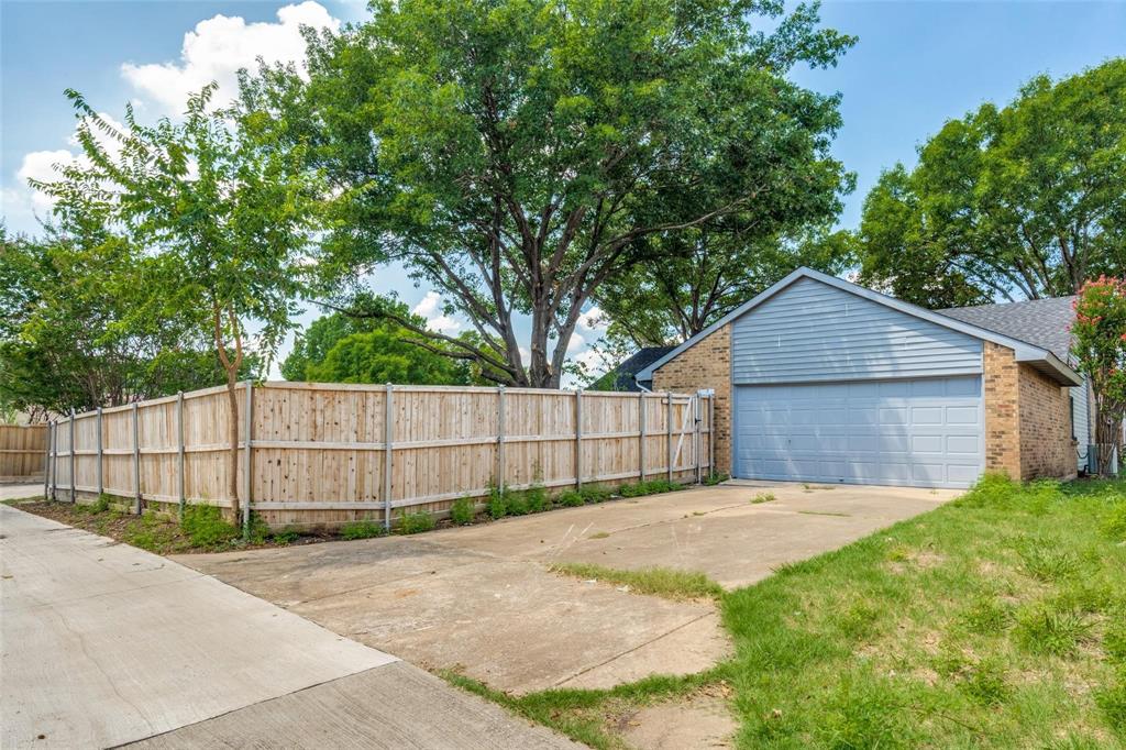 7904 Simpkins Place Plano, TX 75025 - Photo 24 of 24 a view of backyard of house with wooden fence