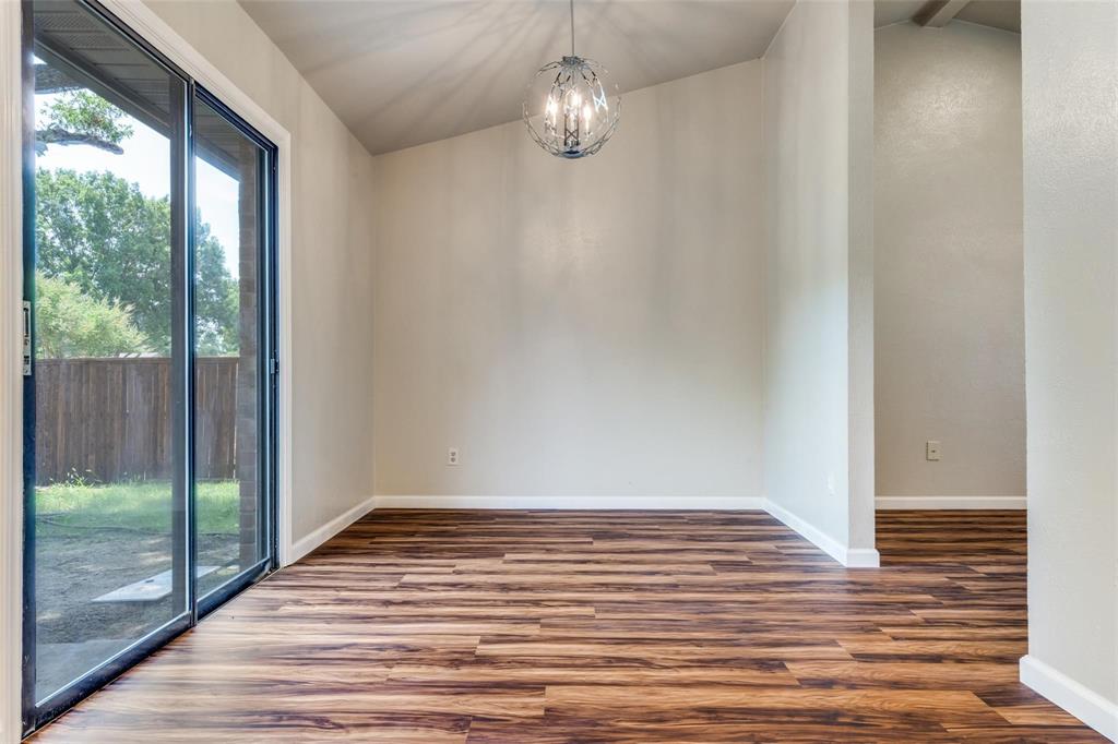 7904 Simpkins Place Plano, TX 75025 - Photo 7 of 24 a view of empty room with wooden floor and fan