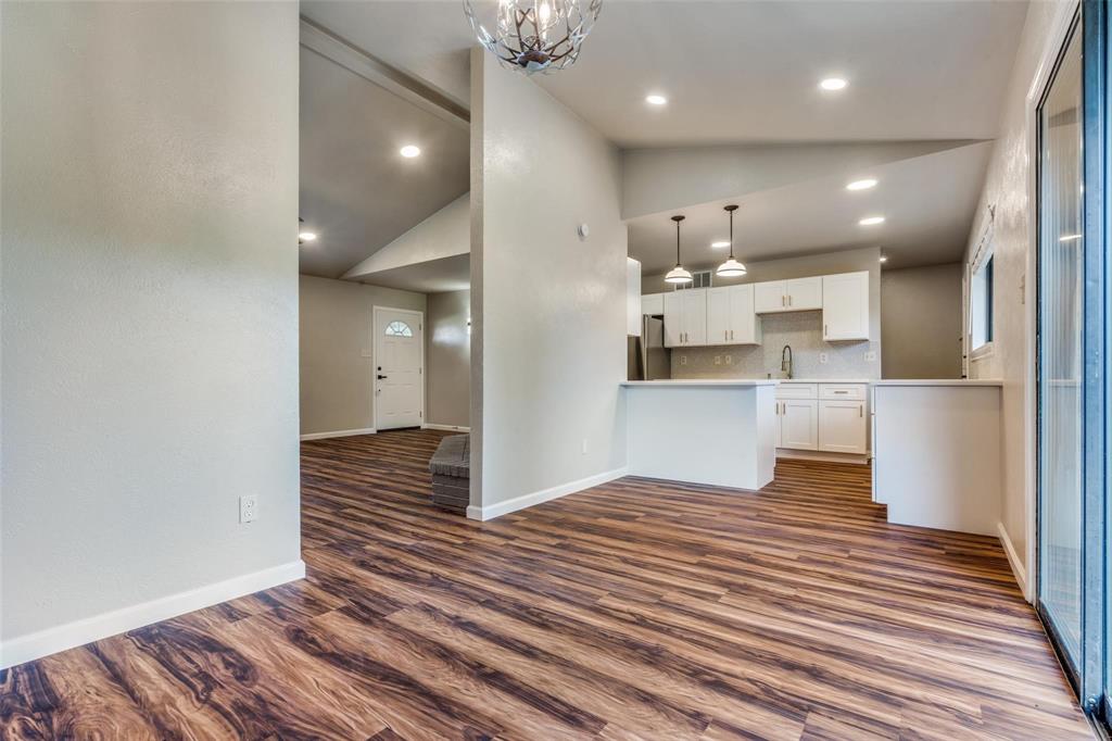 7904 Simpkins Place Plano, TX 75025 - Photo 8 of 24 a view of kitchen and wooden floor