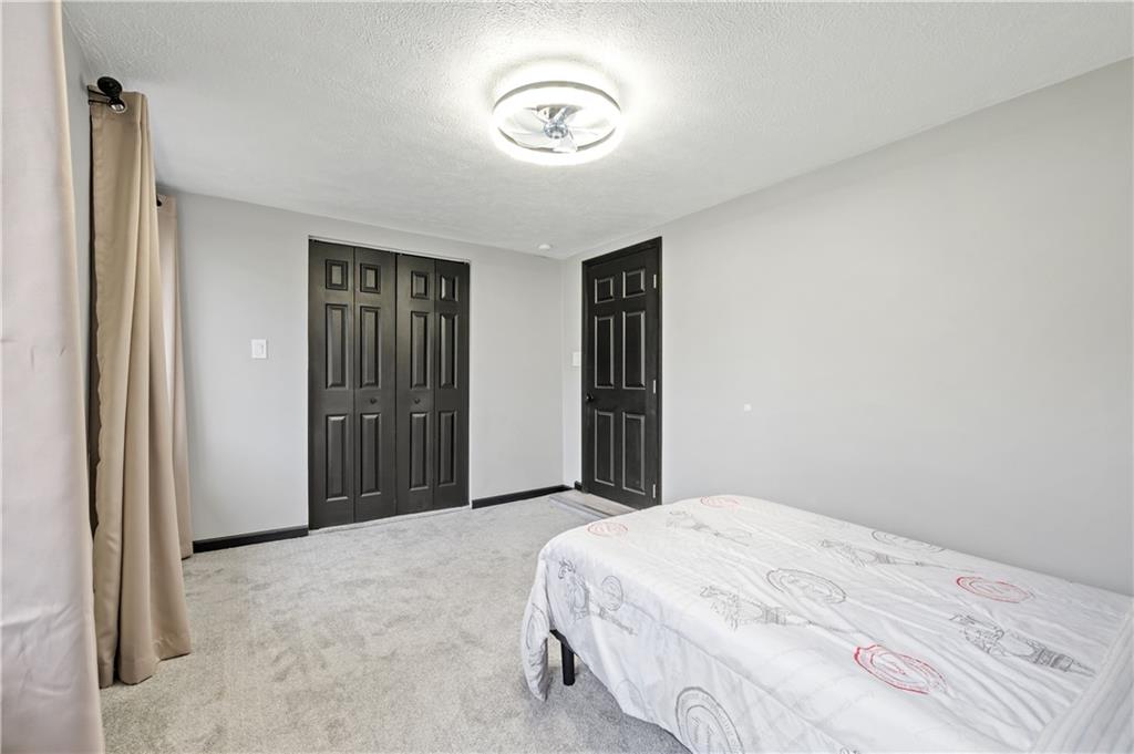 856 Cleveland Avenue Brackenridge, PA 15014 - Photo 24 of 35 a bedroom with a bed and a window
