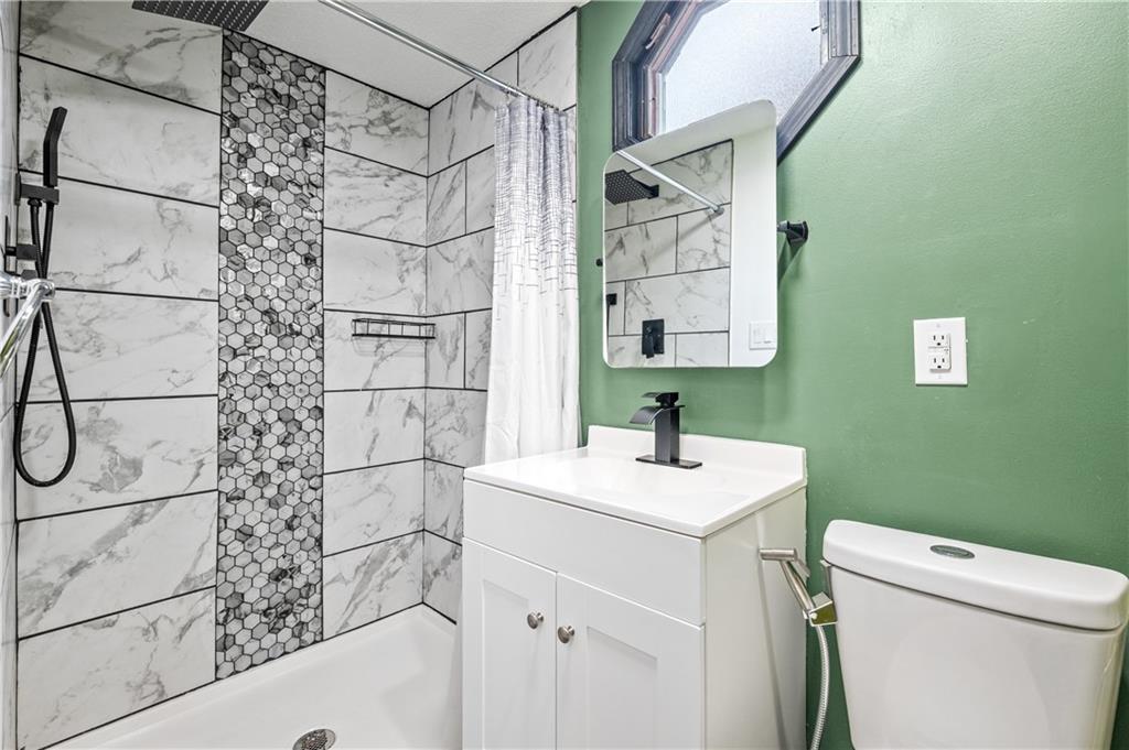 856 Cleveland Avenue Brackenridge, PA 15014 - Photo 29 of 35 a bathroom with a sink a toilet and shower