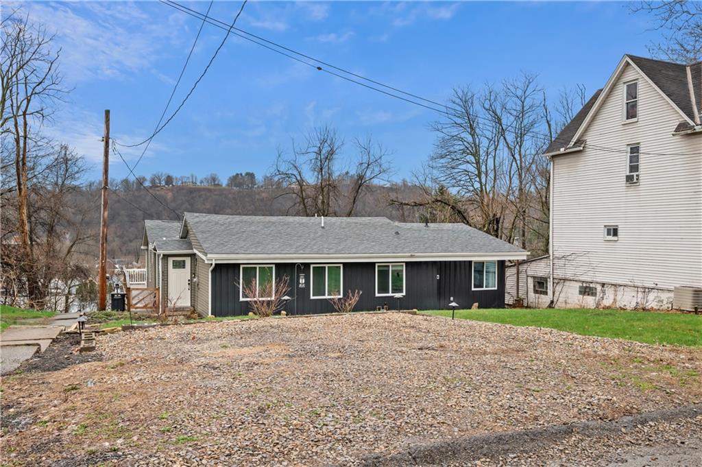 856 Cleveland Avenue Brackenridge, PA 15014 - Photo 3 of 35 a front view of a house with a garden