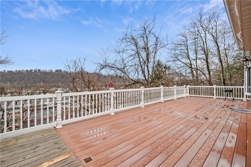 856 Cleveland Avenue Brackenridge, PA 15014 - Photo 5 of 35 a view of a balcony with wooden floor and fence