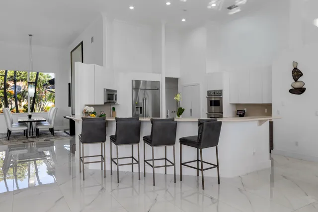 a living room with furniture and a large mirror