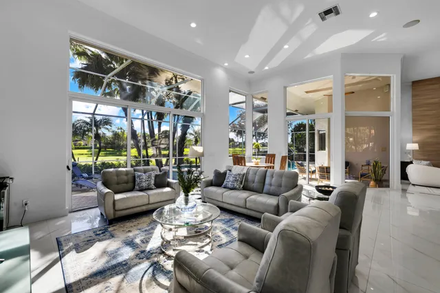 a spacious bedroom with a bed and window