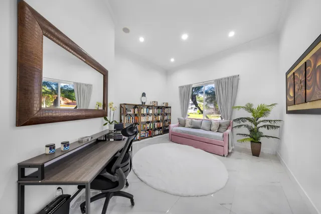 a bedroom with a bed and a television in it