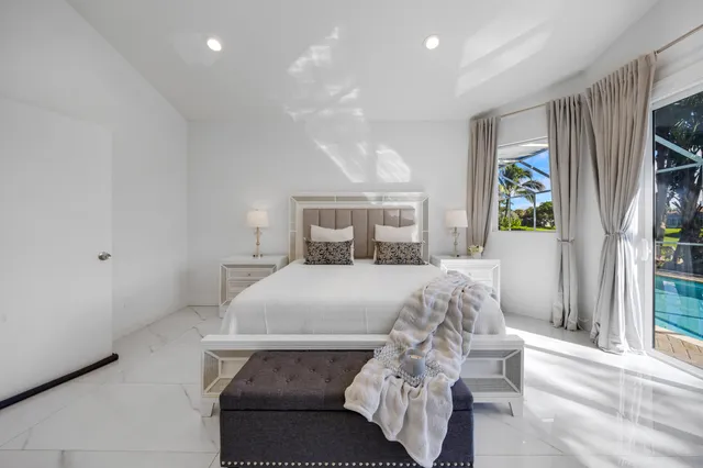 a bathroom with a granite countertop sink mirror and shower