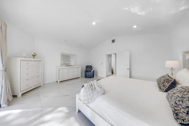 a view of a patio with a table and chairs