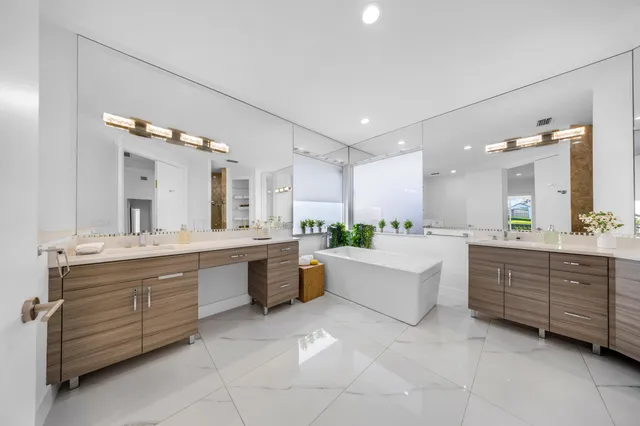 a view of a backyard with sitting area