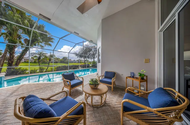 an aerial view of residential house with outdoor space and lake view