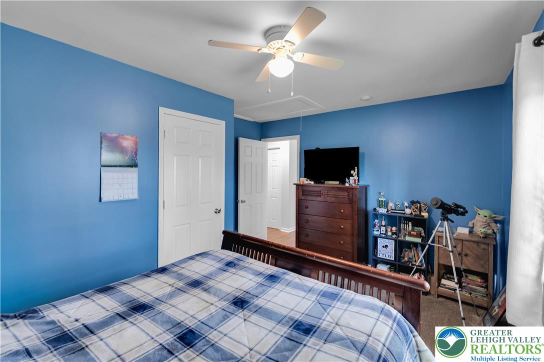 107 Shenkel Road Effort, PA 18330 - Photo 20 of 44 a bedroom with a bed and a flat screen tv