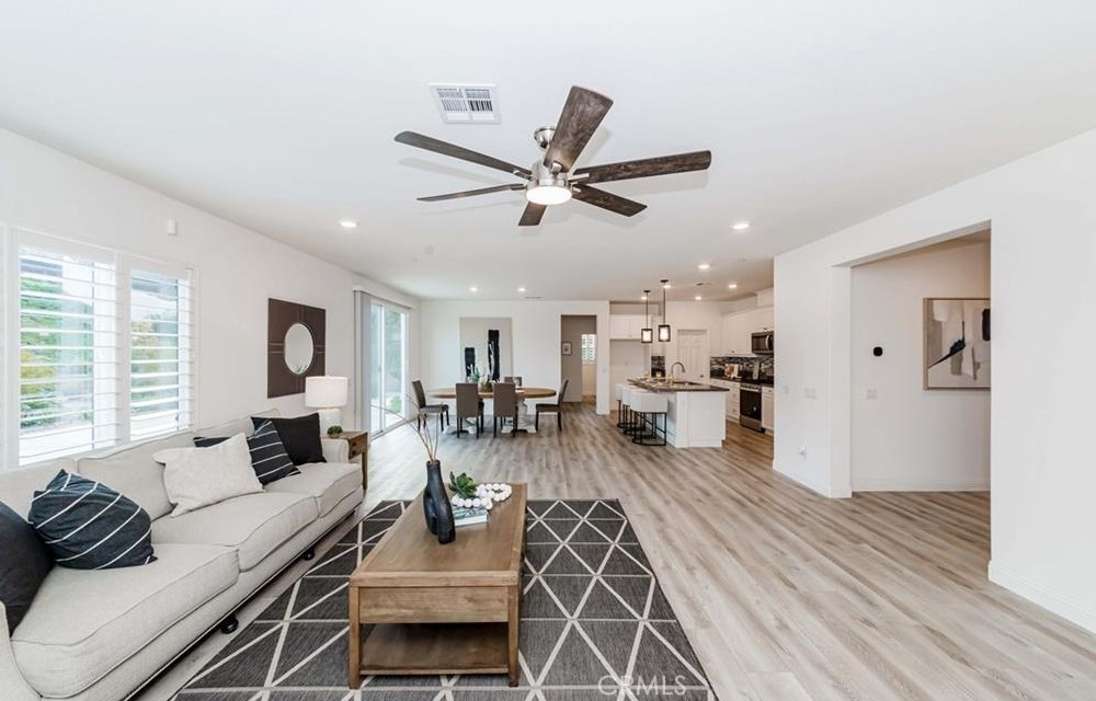 20886 Mountain Gate Drive Riverside, CA 92507 - Photo 11 of 27 a living room with furniture and a large window