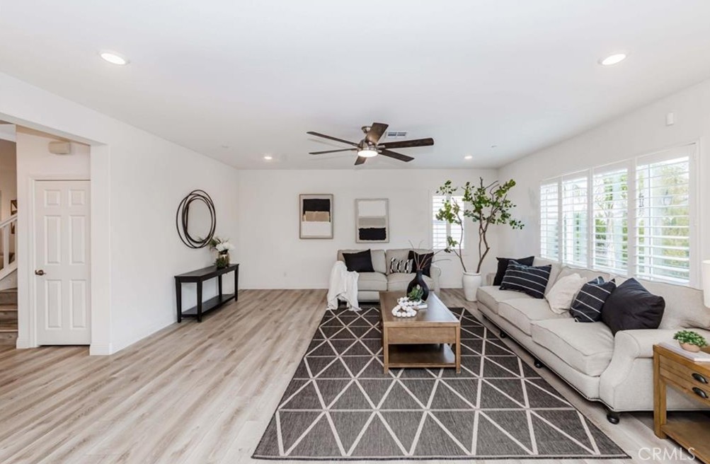 20886 Mountain Gate Drive Riverside, CA 92507 - Photo 12 of 27 a living room with furniture a table and a large window