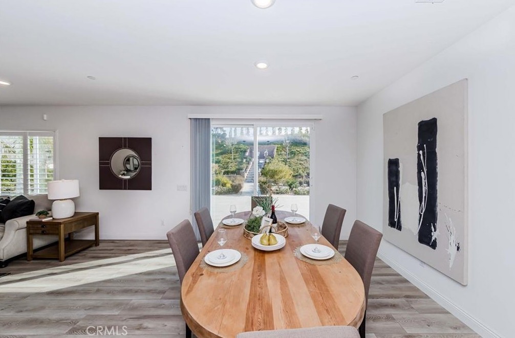 20886 Mountain Gate Drive Riverside, CA 92507 - Photo 15 of 27 a view of a dining room with furniture window and wooden floor