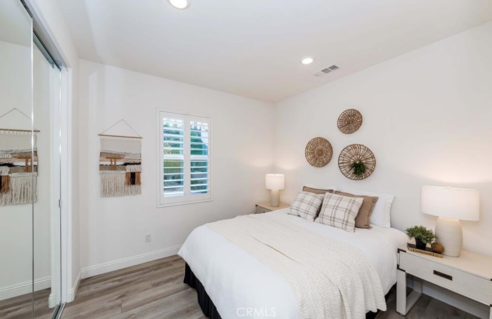 20886 Mountain Gate Drive Riverside, CA 92507 - Photo 17 of 27 a bedroom with bed and a window