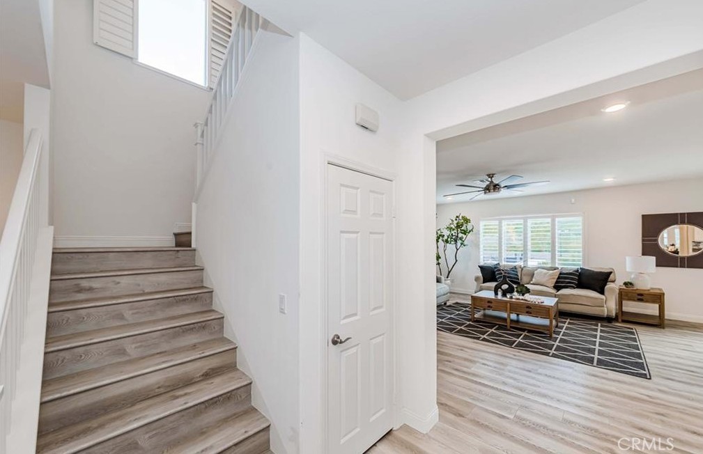 20886 Mountain Gate Drive Riverside, CA 92507 - Photo 19 of 27 a living room with furniture and wooden floor