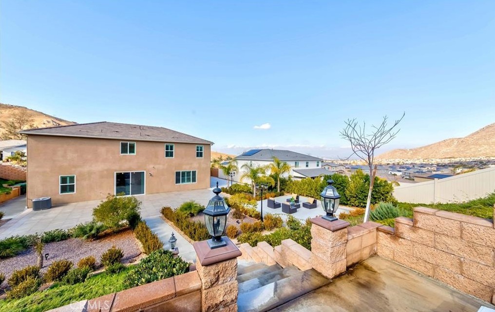 20886 Mountain Gate Drive Riverside, CA 92507 - Photo 26 of 27 a view of a patio with couches table potted plants and water view