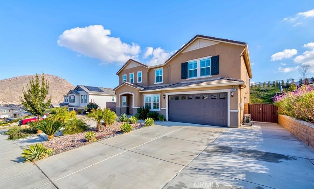 20886 Mountain Gate Drive Riverside, CA 92507 - Photo 3 of 27 a front view of a house with a yard and potted plants