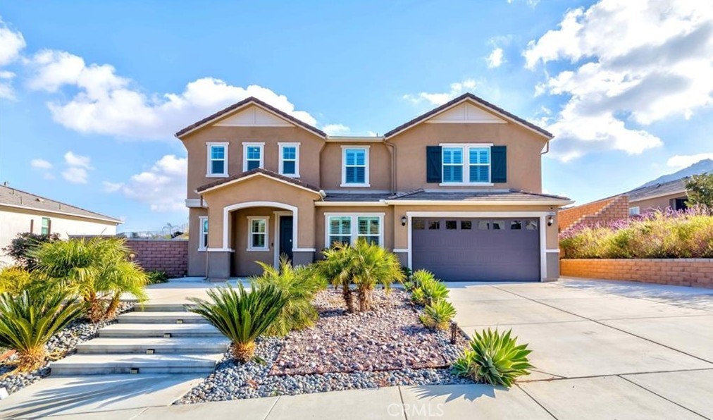 20886 Mountain Gate Drive Riverside, CA 92507 - Photo 4 of 27 a front view of a house with garden