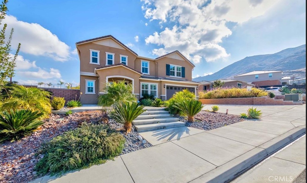 20886 Mountain Gate Drive Riverside, CA 92507 - Photo 5 of 27 a front view of a house with garden