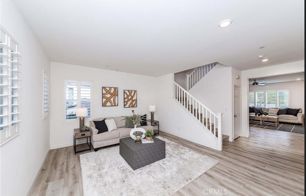 20886 Mountain Gate Drive Riverside, CA 92507 - Photo 8 of 27 a living room with furniture and wooden floor