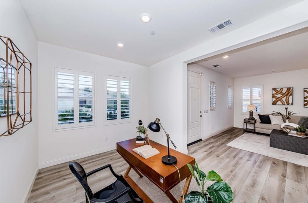 20886 Mountain Gate Drive Riverside, CA 92507 - Photo 9 of 27 a living room with furniture and wooden floor