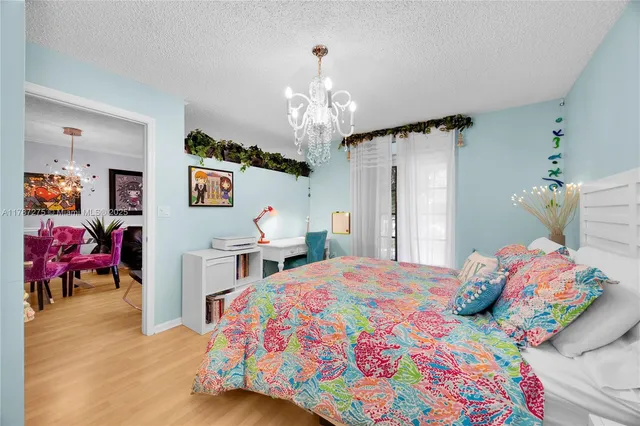 a bedroom with bed and window