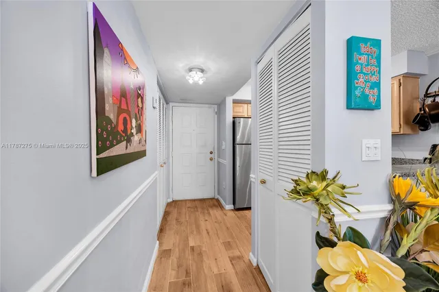 a view of entryway with wooden floor