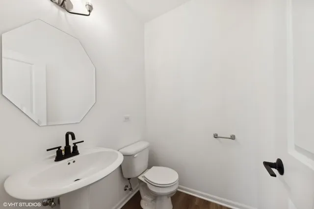 a view of a building with a window and car parked