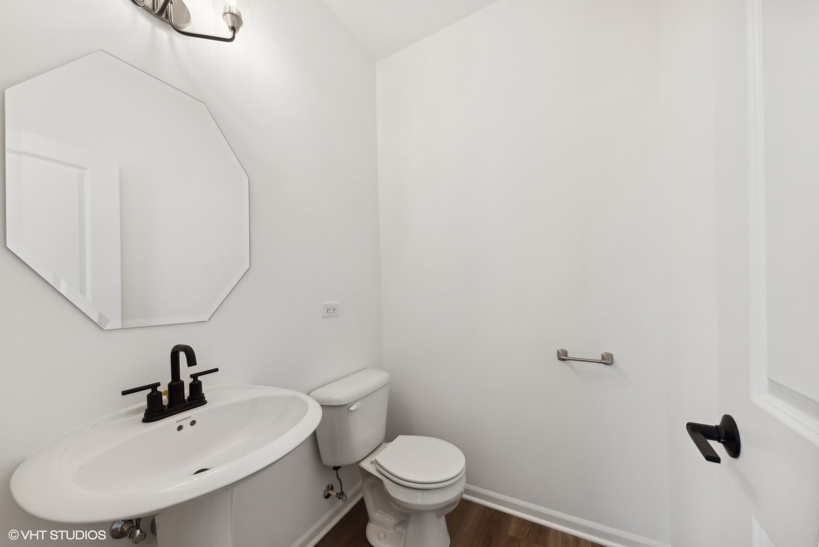 1033 Wren Road Des Plaines, IL 60018 - Photo 18 of 20 a bathroom with a sink a toilet and a mirror
