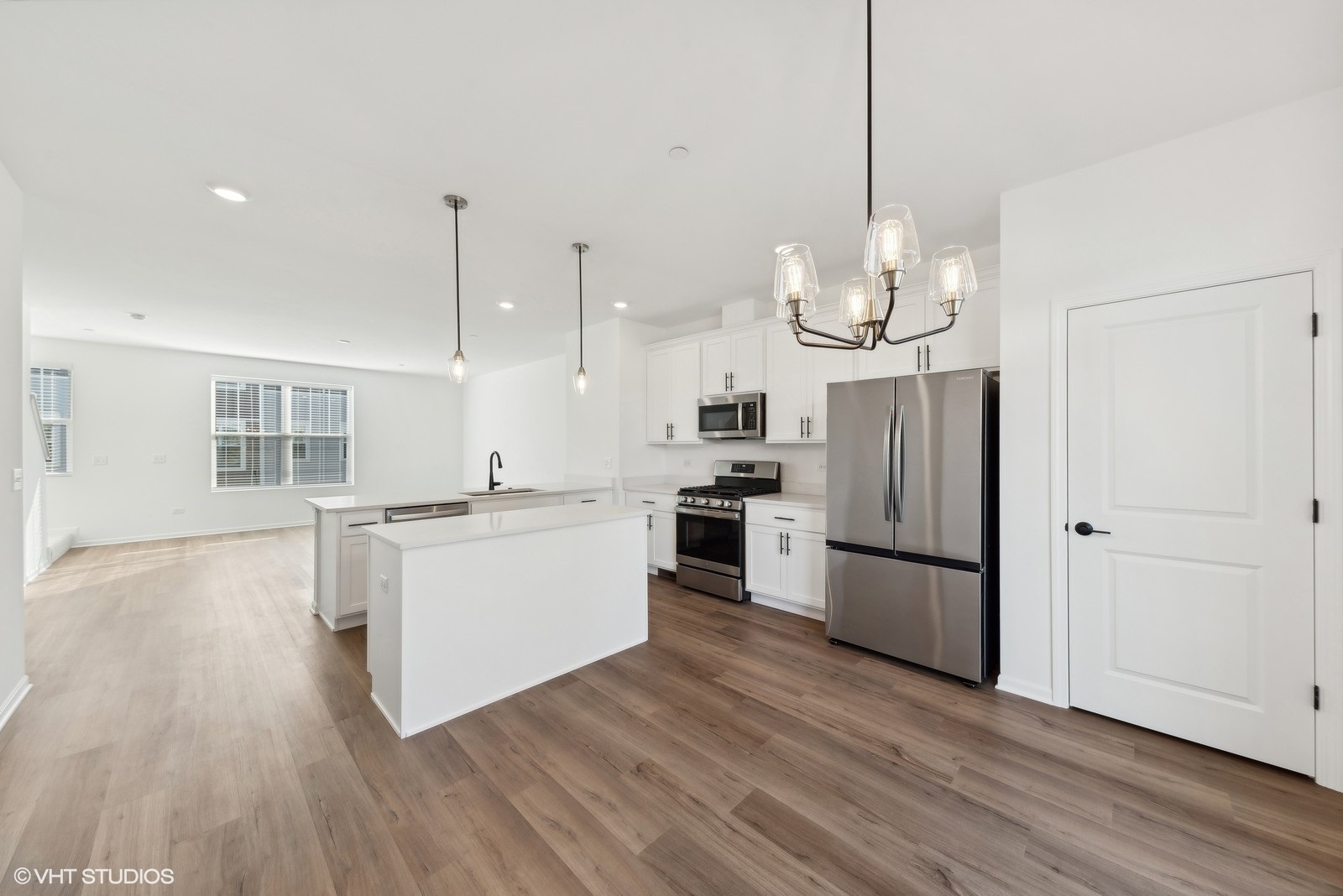 1033 Wren Road Des Plaines, IL 60018 - Photo 8 of 20 a kitchen with stainless steel appliances granite countertop a refrigerator a sink dishwasher a stove and white cabinets with wooden floor