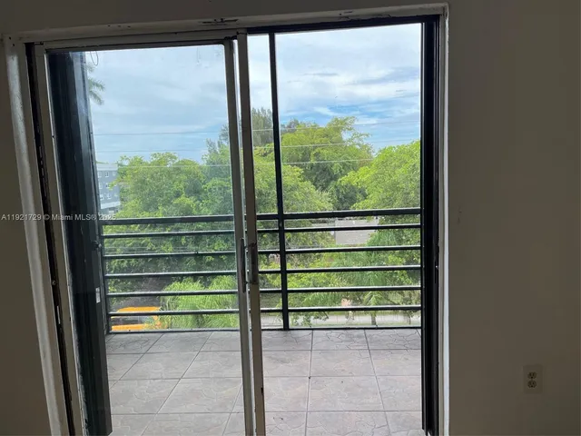 a view of a room with a large window