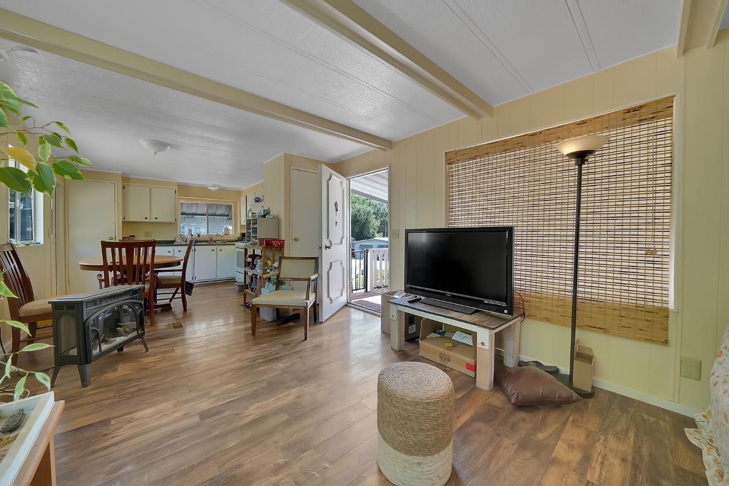 150 Clinton Road, Unit 38 Jackson, CA 95642 - Photo 7 of 18 a living room with furniture and a flat screen tv