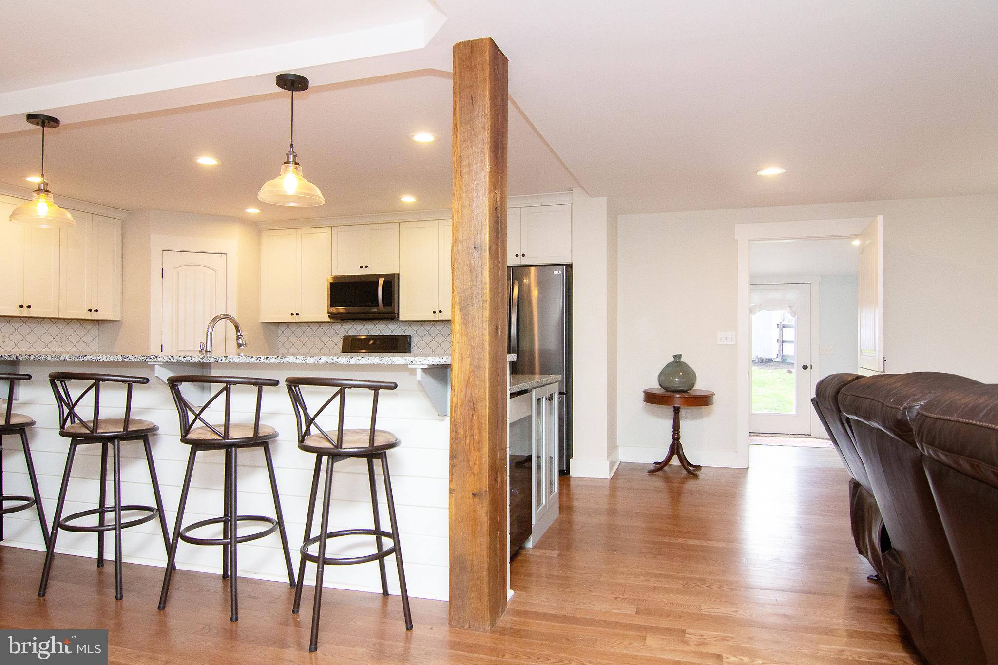 3061 Emmitsburg Road Gettysburg, PA 17325 - Photo 12 of 47 a view of a kitchen with furniture and wooden floor
